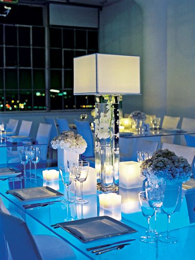 Lampshade Centerpieces  Put a twist on the submerged-flower centerpiece and have your florist top off a tall vase with a chic lampshade. Submerged Flower Centerpiece, Mitzvah Centerpieces, Chandelier Centerpiece, Mitzvah Decor, Unique Wedding Flowers, Beautiful Centerpieces, Flower Ideas, Center Pieces, Bleu Turquoise