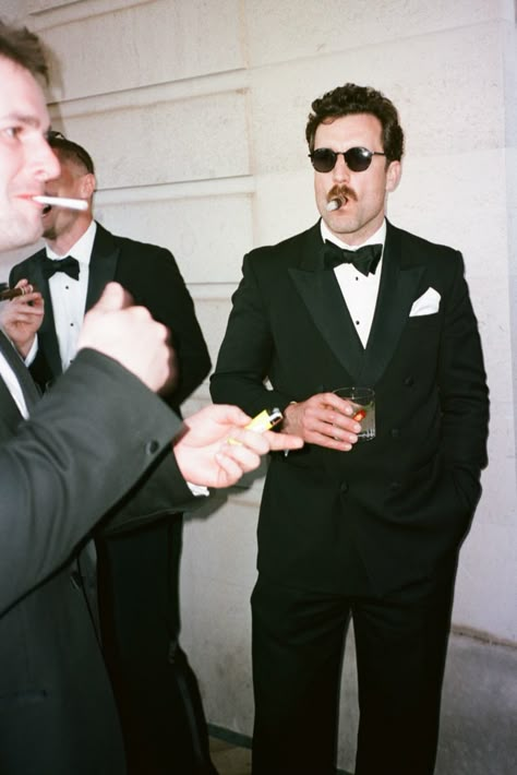 wedding film photography is huge right now and I couldn't be happier! This is a black tie London city wedding at the Ned. Black And White Groom And Groomsmen, Fancy Black Tie Wedding, Noir Wedding Photography, Men In Tuxedo Aesthetic, Mens Black Tie Wedding Guest, Black Tie Old Money Wedding, Groom Black Suit Bow Tie, Black Bow Tie Outfit Men, Vintage Tuxedo Wedding