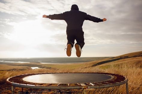 Young man jumping on a trampoline | Premium Photo #Freepik #photo #people #man #nature #sport Jumping On A Trampoline, Jogging Tips, Jumping Trampoline, Small Trampoline, Man Jumping, Water Trampoline, Trampoline Workout, Blue Sky Background, Face Wrinkles