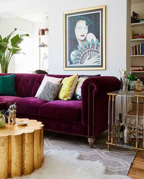 One living room, two views. Swipe to see the glam plum velvet sofa—then tap the link in our bio to tour the kitsch-meets-luxe apartment.… Interior Purple, Purple Couch, Purple Living Room, Casa Retro, Purple Sofa, Minimalist Living Room Decor, Rooms Design, First Apartment Decorating, Fun Furniture