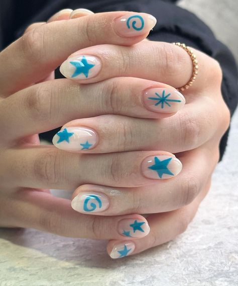 These nails feature a clear base with vibrant blue star and swirl designs, reminiscent of a bright summer sky filled with playful shapes.  🌸Click on the image to shop our trending Korean Gel Polish this season.  🌸Credit: soonsoonail_sillim on Instagram 🌸summer nails, blue star nails, swirl nails, summer manicure, Korean gel polish, trendy nail designs, clear base nails, summer nail trends, playful nail art, summer nail inspiration, gel polish nails, summer nail ideas, blue nail art, summer nail colors, trendy summer nails, star nail design, nail art inspiration, summer nail polish, fun nail designs, summer nail styles Fun Nail Designs Summer, Mixed Nails, Spiral Nails, Nails Turquoise, Nails Swirl, Turquoise Nail Designs, Nails Teal, Nails Star, Nails Funky