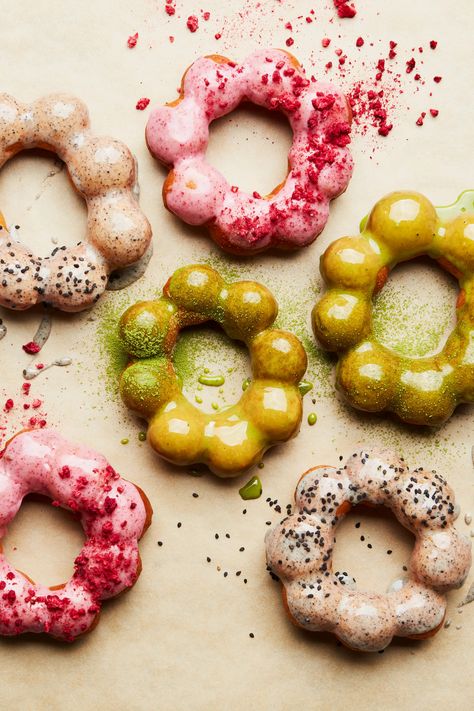 These delicious mochi doughnuts are light, chewy, and gluten-free! The first form of the mochi doughnut came from Hawaii in the early 1990s. The dough for this version can be formed into simpler doughnut rings or just rolled into balls to make doughnut holes. This recipe also includes some of great glazes—try raspberry, matcha, chocolate, ube, black sesame, or several different options! And to make them look extra fun, feel free to garnish with sprinkles, nuts, candy, or whatever you like. Mochi Doughnut, Poi Mochi, Lao Recipes, Rabbit On The Moon, Mochi Recipes, Sweet Rice Flour, Epicurious Recipes, Mister Donuts, Doughnuts Recipe