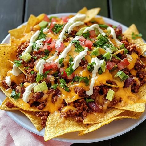 Chili Cheese Nachos Chili Cheese Nachos, Chili Nachos, Cheese Nachos, Cheesy Nachos, Hearty Chili, Chili Cheese, Savory Snacks, Melted Cheese, Tortilla Chips