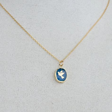 We are beyond in love with this Blue Chalcedony gemstone necklace that features a golden dove in flight. The stone and design is framed by a vermeil border. So pretty, the Dove Gemstone Necklace is sure to be the perfect gift for your loved ones and it also would make a lovely addition to your jewelry collection. Necklaces like this are perfect to add a touch of personality to a look, but can also be paired with other necklaces to create a layered look. Blue Chalcedony gemstone Exact striations, Dove In Flight, Dove Necklace, The Dove, Jewel Box, Blue Chalcedony, In Flight, Pitcairn Islands, Papua New Guinea, Turks And Caicos Islands