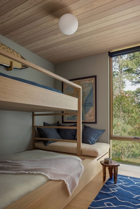 Bedrooms are tucked away at the back of the home. Amagansett House, Bed With Window, Max Strus, Thomas Bedroom, Beach Bedrooms, Coastal Bungalow, Custom Bunk Beds, Beach Chalet, Bunk Rooms