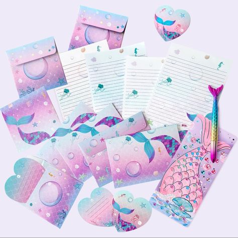 PRICES MAY VARY. Complete Mermaid Stationery Set: Our package includes 20 mermaid-style paper sheets, 10 envelopes, 6 greeting cards with envelopes, a sheet of 150 mermaid pearl crystal stickers, and a beautifully designed mermaid tail ink pen. This set marries aesthetic appeal with practicality, making it a hit with both boys and girls. Enchanting Sea Creature and Mermaid Design: The stationery in this set features designs of mermaid scales, starfish, scallops, conch, seahorses, and mermaids. T Print Portfolio, Mermaid Pearl, Printed Portfolio, Crystal Stickers, Mermaid Design, Letter Writing Paper, Mermaid Style, Mermaid Scales, Sea Creature