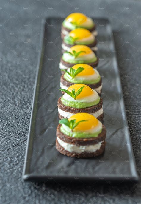 Canape with fried quail eggs by Alexander Prokopenko on @creativemarket Quail Egg Recipes Appetizers, Quail Egg Appetizer, Quail Egg Recipes, Creative Egg Recipes, Office Treats, Egg Appetizer, Avocado Party, Quail Recipes, Fried Quail