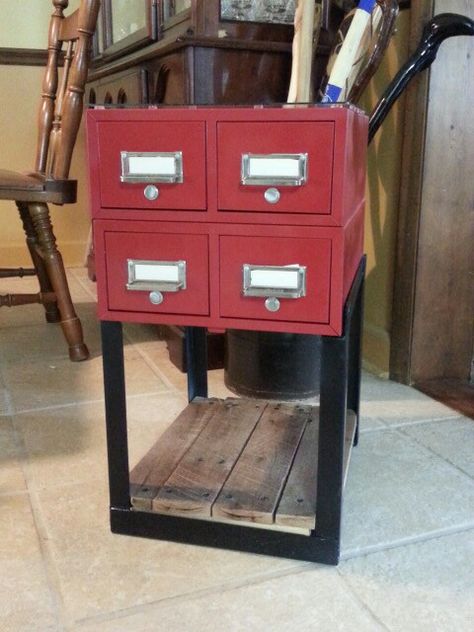 Upcycled metal card catalog in a welded frame. I used angle iron from a old bed frame. The bottom shelf is recycled pallet wood. Since I didn't have the rods for the drawers, I used hex bolts and fastened them with bolts. To give the bolts the right look; I sanded the tops smooth. I put a glass top on to protect the finish. Metal Drawers Repurposed, Repurposed File Cabinet Ideas Metal, Metal Tool Box Upcycle, Upcycled Metal Filing Cabinet, Repurposed Card Catalog, Upcycling Metal Filing Cabinets, Industrial Drawers, Farmhouse Cabinet, Old Bed Frames