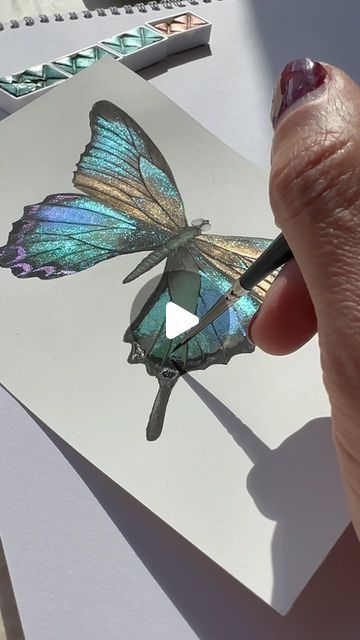 Metallic&shiny watercolor artist on Instagram: "✨Beauty of butterflies 🦋 ✨Wishing you a great weekend y’all 💆🏻‍♀️✨ . Using ghost pearls & sapphire shifters from @skrim_watercolors . 100% cotton hot pressed paper @fabriano1264 . . . . . #butterfly #beauty #butterflylove #butterflys #butterflytattoo #butterflyart #watercolortattoo #artlover #watercolortutorial #watercolortattoo #butterfly #butterflydrawing #watercolorart #art #aquarelle #drawing #illustration #illustrationartists #zarinartist" Glitter Kunst, Finetec Watercolor, Aquarelle Drawing, Butterfly Art Painting, Pressed Paper, Watercolor Paint Set, Watercolor Projects, Glitter Art, Art Aquarelle