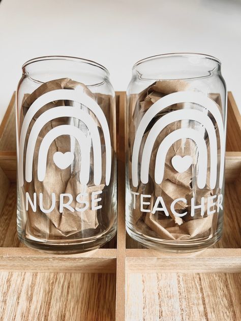 Perfect handmade gift for nurses and teachers! Each glass cup holds 16 ounces of both cold and hot drinks! Care Instructions: Do Not Soak in Water Do Not Use In Dishwasher Hand Wash Only Do Not Microwave Teacher Glass Can Cup, Nurse Glass Cup Ideas, Teacher Vinyl Cups, Teacher Beer Glass Cup, Nurse Cup Ideas, Cricut Nurse Gifts, Cricut Glass Cup Ideas Vinyls, Wildfire Spirit, Glass Cup Design Ideas