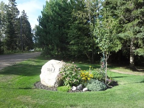 flower beds around signs | here's the flower bed at the front of the property with the house ... Rock Flower Beds, Garden Front Of House, Landscaping Around House, Driveway Landscaping, Landscaping With Boulders, Front Landscaping, Landscaping With Large Rocks, Front Lawn, Front Yard Garden