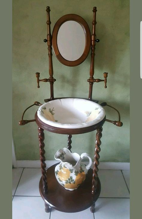 Finally, I own one...#luvnlyfe!   Antique Cash Family 1945 pottery wash basin and pitcher made in Edwin Tennessee with wood stand. Has yellow roses motif. Dining Washbasin, Wash Basin And Pitcher, Antique Wash Stand, Antique Pitcher, Wash Stand, Wash Tubs, Candle Mirror, Wood Stand, Wash Basin