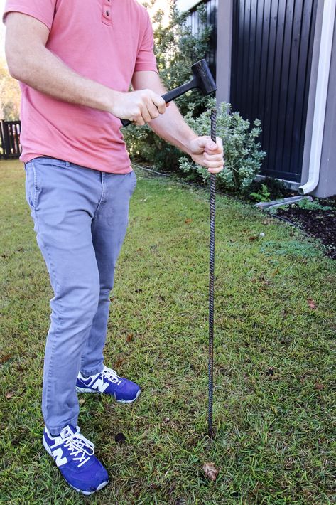 Hammering rebar into ground Rebar Christmas Tree Diy, Rebar Christmas Tree, Christmas String Lights, Pvc Pipe, Diy Christmas Tree, Xmas Tree, All Things Christmas, String Lights, Christmas Decorations