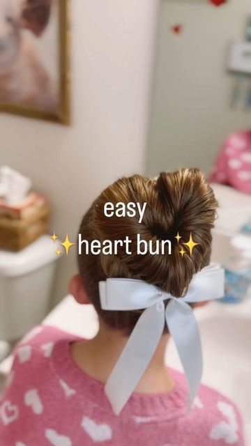 Elaina Zinke on Instagram: "The cutest heart bun for Valentine’s Day! And way easier than it looks. 💘💘 **Hair bows and my favorite hair essentials are linked in my Amazon Storefront (in my bio) under “Hair” #heartbun #valentinesdayhair #hairideasforgirls #easyhairstyles #easyhairstylesforgirls #hearthair #holidayhair #hairbowsforgirls #valentinesdaywithkids" Girls Valentines Hair, Heart Buns Hairstyle Tutorial, Heart Buns Tutorial, Heart Shaped Buns Hair, Heart Bun Tutorial, Heart Buns, Heart Buns Hair, How To Make Heart Buns Hair, Heart Bun