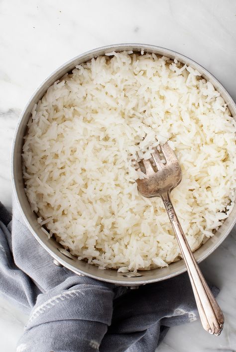 Learn how to cook perfect rice on the stove! This easy, 30-minute method yields tender, fluffy rice every time. Serve it as a side dish, or add it to stir fries, burritos, and more! | Love and Lemons #howto #rice #glutenfree #recipe Cook Jasmine Rice, Oven Baked Rice, Rice Pilaf Recipe, Rice On The Stove, Glutenfree Recipe, Pilaf Recipes, Cooking Jasmine Rice, Fluffy Rice, Steamed White Rice