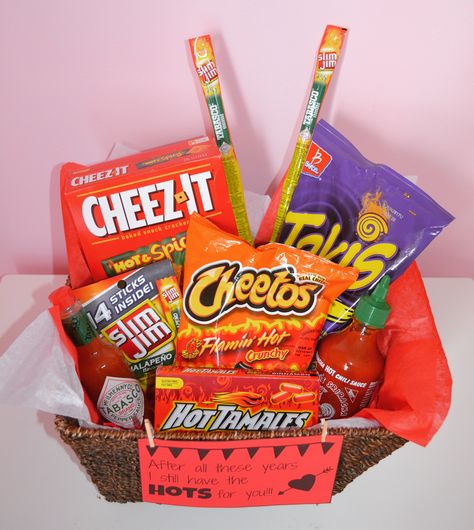 Valentine's Day gift basket for the spicy food lover! #valentinesdayidea #valentinesideaformen #spicyfood #valentinesdaygiftv Spicy Basket Ideas, Hot And Spicy Gift Basket Ideas, Spicy Gift Basket Ideas, Spicy Valentine Gift Ideas, Spicy Gifts For Boyfriend, Snack Gift Basket Ideas, Birthday Baskets, Valentine's Day Food, Food Gift Ideas