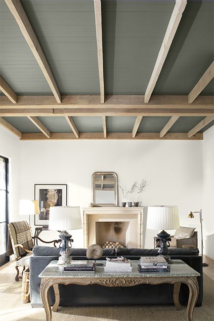 A modern neutral palette living room with high wood panelled ceiling painted in a dramatic gray. Dark Gray Paint, Painted Wood Ceiling, Painted Ceiling Beams, Trashy Y2k Bedroom, Dark Gray Paint Colors, White Ceiling Paint, Painted Beams, Ceiling Paint Colors, Y2k Bedroom