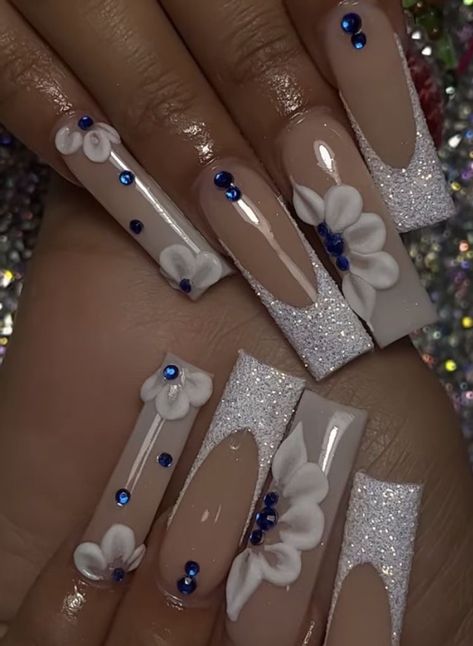 Trendy Acrylic Nails With Gems, White Designed Acrylic Nails, Acrylic Nails With 3d Flowers And Diamonds, White And Blue Birthday Nails, Nails Acrylic Designs Gems, White Nails Quinceanera, Nails For A Quinceanera, White Acrylic Nails Medium Length Design, Quince Nails White And Silver