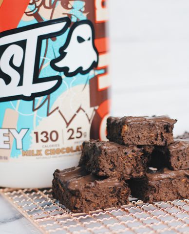 Got a sweet tooth? Try my Protein Fudge Brownies! Since they're made with GHOST® Whey Milk Chocolate, they make a DELICIOUS AF pre or post-workout snack too – enjoy! Ingredients 1 Scoop GHOST® Whey Milk Chocolate 392 grams Sweet Potato — cooked & mashed 120 grams Almond Butter – melted 112 grams Plain Nonfat Greek Ghost Whey Protein Shake Recipes, Ghost Protein Shake Recipes, Ghost Whey Protein Recipes, Ghost Nutter Butter Protein Recipes, Ghost Protein Recipes, Pescience Protein Recipes, Ghost Protein Powder Recipes, Pescience Recipes, Protein Mix Recipes