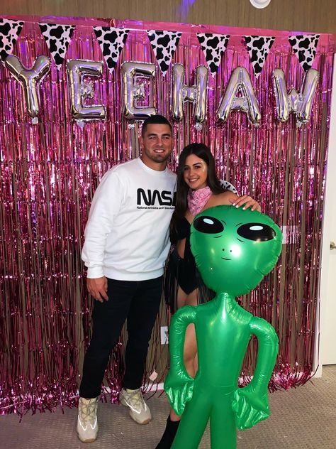 #spacecowboy #couplecostumes #cowboy #cowgirl Aliens And Cowboys Theme, Cowboy And Aliens Party, Space Cowboy Decorations, Alien Cowgirl Party, Space Cowgirl Decorations, Cowboy Alien Party, Neon Cowboy Party, Space Cowboy Party Decorations, Cowboys And Aliens Party