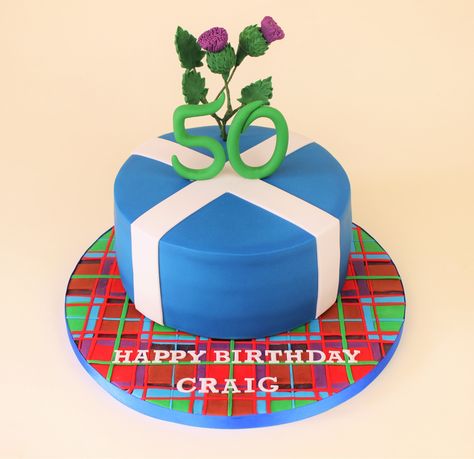 Scottish cake with thistles, tartan and the flag of Scotland Scottish Birthday Cake, Scottish Cake Decoration, Scottish Cakes, Masters Party, 30th Ideas, Fondant Ruffles, Flag Of Scotland, Scottish Pride, Easy Cakes