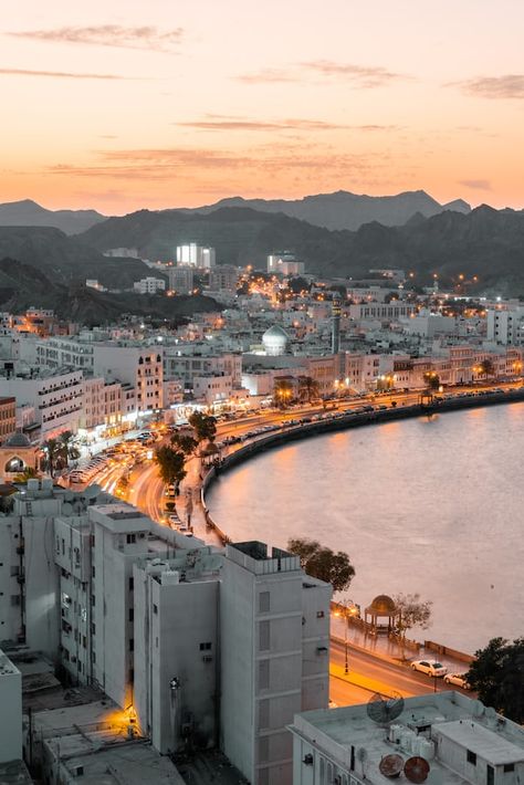 city skyline during night time photo – Free Image on Unsplash Muscat City, Oman Tourism, Popular Travel Destinations, Best Pubs, Pyramids Of Giza, The Tourist, Muscat, Green Mountain, Lost City