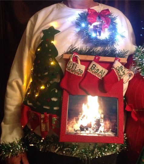 Ugly sweater; live fireplace ( using iPad app for fireplace) Fireplace Christmas Sweater, Creative Ugly Christmas Sweater, Ugly Sweater Ideas, Homemade Ugly Christmas Sweater, Ugly Christmas Sweater Ideas, Ugly Christmas Sweater Diy Funny, Ugly Christmas Sweater Outfit, Tacky Christmas Party, Ugly Christmas Sweater Contest