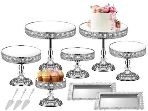 PRICES MAY VARY. Dessert Cake Stand Set --- This dessert display set contains 6 pieces of silver cake stands in different sizes, they are approximately 12 inch, 11 inch, 10 inch, 9 inch, 8 inch and 7 inch in diameter. Also included are two cake trays, 3 cake spatulas and a pair of gloves. The cake trays measure approximately 14 x 11 inches. Elegant Design --- The round cake display stand has an elegant European design. Attractive crystal edges, a stylish carved base and a beautiful centre column Dessert Table Display, Cake Display Stand, Silver Cake Stand, Crystal Cake Stand, Silver Display, Metal Cake Stand, Round Cake Stand, Baby Shower Dessert Table, Cake Stand Set