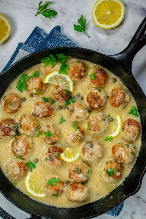 These easy Chicken Piccata Meatballs are stuffed with mozzarella, and cooked all in one pan in a creamy, decadent Piccata sauce! These tender and flavorful chicken meatballs with molten gooey cheese are impossible to resist! Giada Chicken Piccata Meatballs, Giada Chicken Piccata, Meatballs Stuffed With Mozzarella, Chicken Piccata Meatballs, Easy Chicken Piccata, Piccata Sauce, Perfect Meatballs, Mozzarella Stuffed Meatballs, Best Meatballs