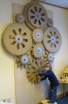 how to cut cogs cardboard craft - Google Search Time Machine Decorations, Maker Fun Factory Vbs 2017, Library Makerspace, Maker Fun Factory Vbs, Maker Fun Factory, Gear Wall, Interactive Walls, Fun Factory, Gear Art