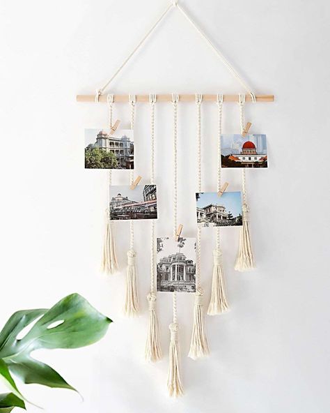 Or hang a boho-inspired photo display to keep your memories organized and actually on display for those pictured to see and reminisce — and it comes with 25 removable wood clips ready to go! 27 Lazy Ways To Decorate Your Home Hanging Photo Display, Christmas Shoebox, Instax Polaroid, Pola Macrame, Picture Organization, Wood Clips, Diy Wand, Photo Wall Decor, Handmade Wall Decor