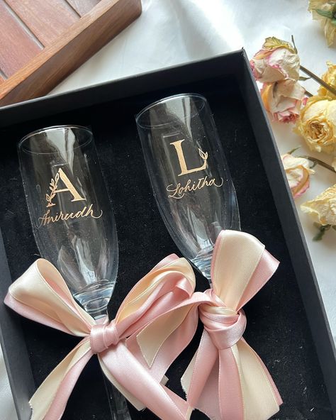 Our engraved champagne glasses are definitely a hit! ✨ We recently made them for a client, engraving their friends’ initials and names on them as return favors. They are sure to make a lot of noise out there! 🫶🏻 . . . #delhicalligrapher #indiancalligrapher #engravingart #engravingartist #engravedglasses #engravedwineglass #engravedchamagneglasses #personalisedglasses #personalisedgifts #personalisedgift #engravingart Wedding Engraving Ideas, Wedding Return Gifts, Bridal Shower Gifts For Bride, Personalised Glasses, Glass Engraving, Wedding Day Gifts, Engraving Art, Champagne Glasses, Design Business