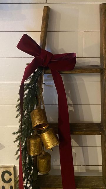 GreenMary on Instagram: "This is my latest DIY Christmas decoration. Used an old wood sigh and painted it white, took a stencil for the Christmas letters. Aged the sign with sand paper, and brown shoes wax. I bought this old wooden ladder for nothing on market place once. I thrifted red rubban and bought bells on Amazon. The garland was found at homesense. #christmas #christmasdecor #christmasdecor #christmasdeco #diyproject #christmasdiy #christmasprojects #decoonabudget #projetdenoel # Wooden Ladder Decor, Old Wooden Ladders, Shoe Wax, Christmas Letters, Sand Paper, Wooden Ladder, Brown Shoes, Christmas Lettering, Old Wood