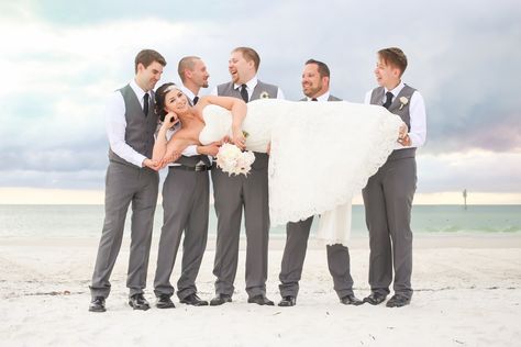 Groomsmen Wearing Grey Suits Holding Bride | Hilton Clearwater Beach Bridal Party Portrait Shoes With Straps, Beach Bridal Party, Clearwater Beach Wedding, Party Portrait, Grey Suits, Diy Wedding Reception, Beach Wedding Shoes, Beach Wedding Reception, Purple Wedding Theme