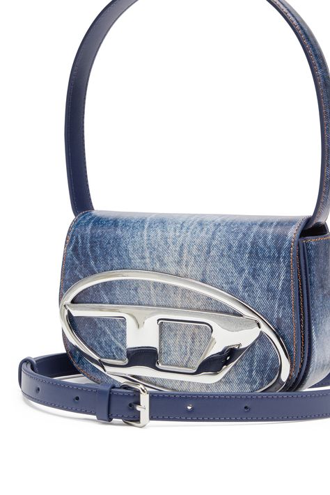 This women's shoulder bag is one of the season's most sought-after accessories. It's crafted from smooth leather that's digitally printed with an image of treated denim – a Diesel signature – and detailed with classic tobacco-coloured stitching. The flap silhouette is enriched by shiny Oval D hardware, while a longer detachable strap allows for crossbody wear.-Top handle that can be folded under the bag;Detachable and adjustable strap;Magnetic flap closure;Inside: slip pocket and flat compartmen Diesel Shoulder Bag, Printed Leather Bag, Denim Print, Denim Chic, Handbag Heaven, Bag Design, Indigo Blue, Printed Leather, Blue Bags