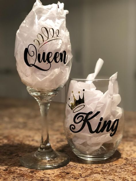 King and Queen wine glasses!! This would be perfect for that Bride and Groom, Anniversary gift, Birthday gift or just for that special someone! This could also be cute for that newly engaged couple as well.  YOU CAN CHOOSE THE LETTER COLORING OF YOUR CHOICE.. PLEASE MSG ME THAT INFO..   CARE INSTRUCTIONS **I use only premium vinyl. This vinyl is strong, but over time can pull away from the surface if not properly cared for. **ALWAYS hand wash in warm soapy water. **Please DO NOT SOAK in water. * Couple Wine Glasses, Couples Wine Glasses, Glitter Wine Glasses Diy, 21st Birthday Ideas, Wine Glass Sayings, Wine Glass Decor, Glitter Wine Glasses, Diy Wine Glasses, Personalized Wine Glasses