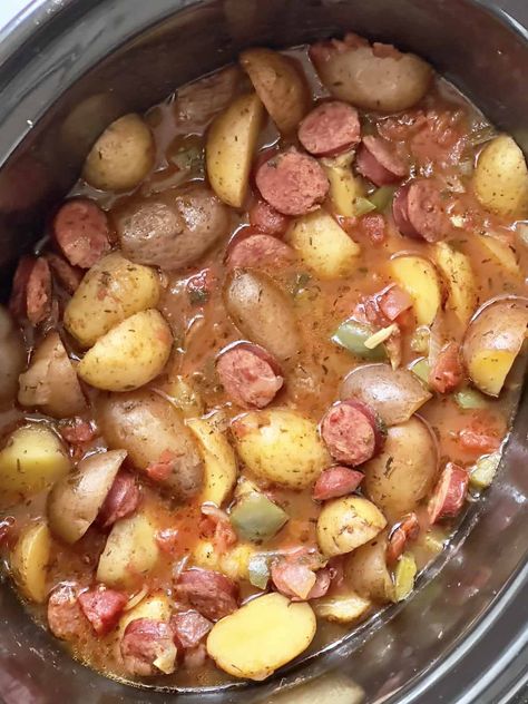 This is one of the best kielbasa and potato crock pot recipes! This is such an easy dump and go dinner full of tender potatoes, the rich flavor of Polish sausage and wholesome peppers, tomatoes and onions. Made with simple ingredients you likely already have in your pantry, this crockpot sausage and potato recipe is great on a busy weeknight or a lazy weekend. This delicious meal is also great for meal prepping as it's hearty and well-balanced, making a great lunch or dinner for work. Crockpot Sausage And Sweet Potatoes, Turkey Sausage Crockpot Recipes, Potato Crock Pot Recipes, Sausage And Potatoes Casserole, Potato Crock Pot, Crockpot Kielbasa, Kielbasa Potatoes, Kilbasa Sausage Recipes, Crockpot Sausage And Potatoes