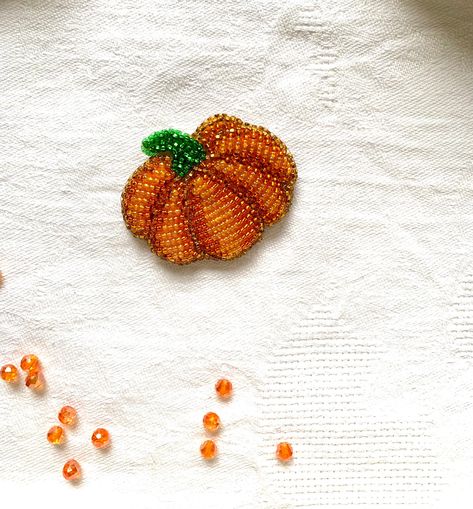 Decoration pumpkin gift for Halloween. Beaded pumpkin will decorate your Hollow and Thanksgiving day. You can make a gift to your friend or mom. Orange decoration is a symbol of autumn For this brooch, you can purchase an orange-green choker. It will be very relevant for the fall. Care and cleaning instructions: - store in a dry place, preferably in a box; - do not use water or chemicals for cleaning; - wipe gently only with a dry cloth or brush if you need to add shine - try not to get hairspra Halloween Beaded Embroidery, Halloween Bead Embroidery, Beaded Embroidery Christmas, Bead Embroidery Ideas, Bead Embroidery Patterns Beadwork Design, Embroidery Gifts For Friends, Beading Clothes, Beaded Pumpkin, Beaded Orange