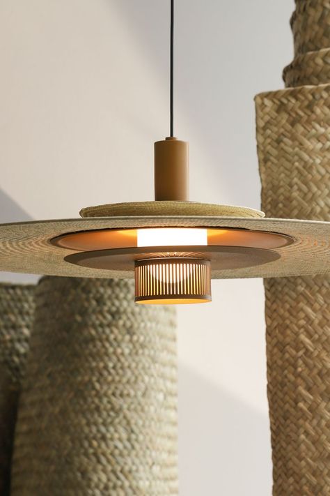 Palma beige pendant light brings together a handwoven palma shade with a sophisticated chrome, coated metal piece in ochre or white. The contrast between a striking metal texture marked by fine openings and the soft weaving surface creates an intriguing interplay between industrial production and craft techniques. The subtle tone of the beige palma matches perfectly any warm space. #davidpompa #design #palma #mexico #interior Rattan Pendant Lamp, Japanese Pendant Light, Metal Lighting Design, Japandi Lighting, Unique Pendant Lighting, Mexico Interior, Unique Pendant Lights, Concrete Light, Pendant Lamp Design