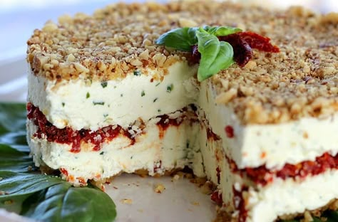 Cheese, Basil and Sun Dried Tomato Torte made with feta, cream cheese and Parmesan. Basil, garlic and tomatoes add complex texture and flavor. #recipes #appetizers #creamcheese #cheeseball #feta #sundriedtomato #basil Savory Cheesecakes, Savory Cheesecake, Mediterranean Recipe, Savory Cheese, Best Party Food, Snack Dip, Party Food Platters, Savoury Baking, Party Food Appetizers