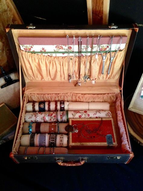 vintage suitcase/portable jewelry display. The inside of the suitcase is in mint condition so I didn't want to do anything permanent. I covered a piece of corkboard with fabric and tucked it in the large pocket to pin jewelry for display and also covered paint rollers and pool noodles to display bracelets. Old Suitcase Jewelry Display, Suitcase Jewelry Display Ideas, Bracelet Display Ideas Craft Fairs, Suitcase Craft, Display Bracelets, Vintage Jewelry Display, Jewerly Display, Craft Show Booths, Paint Rollers