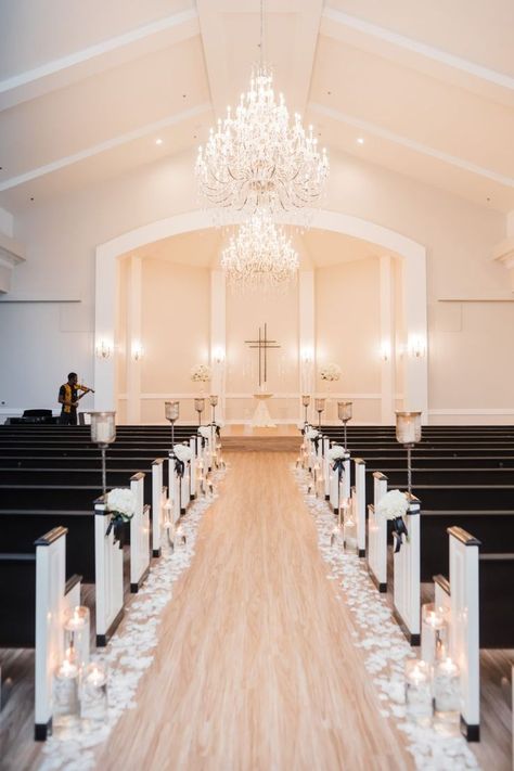 alter church wedding day elegant classy white and black seats with candles and chandeliers Candle And Flower Wedding Aisle, Candle Lit Aisle, Wedding Aisle Candles, Wedding Flowers Candles, Rose Petal Candle, Aisle Candles, Summer Wedding Ceremony, Church Wedding Flowers, Black And White Wedding Theme