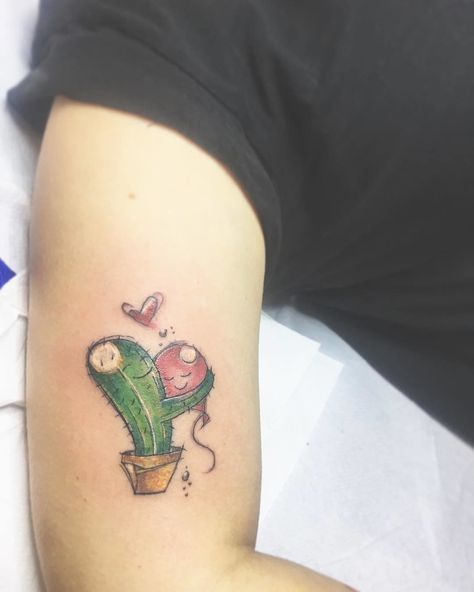 CafeMom.com : Cactus Love Tattoo : 40 Heartfelt Tattoos That Make Us Want to Fall in Love -- How cute is this illustration of a cactus loving a balloon? The cartoon style and bright colors give it a real sense of happiness. It's adorable. Cup Of Tea Tattoo, Tattoo Cactus, Funny Small Tattoos, Mandala Tattoo Shoulder, True Love Tattoo, Balloon Tattoo, Cute Cat Tattoo, Cactus Tattoo, Love Tattoo