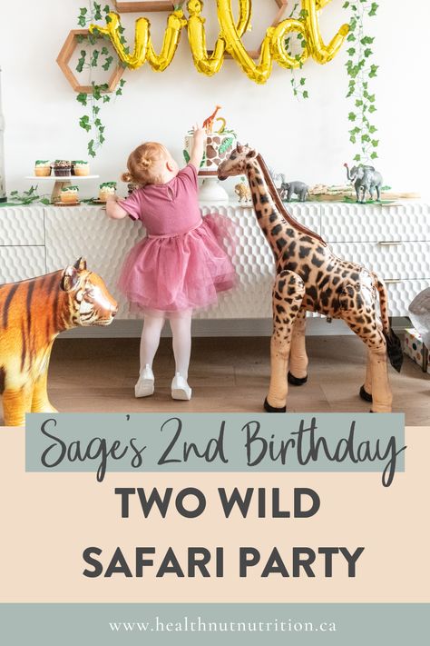 Two wild birthday party decorations over a table with the birthday girl getting a taste of cake. Wild Safari Birthday Party, Zoo Birthday Party, 2nd Birthday Party For Girl, Wild Birthday Party, Zoo Birthday, Two Wild, Wild Safari, 2nd Birthday Party Themes, 2nd Birthday Party