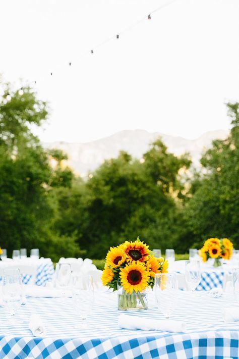 A country-themed rehearsal dinner features blue and white checkered table clothes with vases of sunflowers in the center. This simple design paired with the causal style of the dinner made for a relaxed rehearsal dinner before the big day. | Joie de Vivre: Los Angeles Wedding and Event Planner | Sunflower Rehearsal Dinner Decorations, Checkered Table, Descanso Gardens, Sr 25, Rehearsal Dinner Decorations, Table Clothes, Library Wedding, Beverly Hills Hotel, Golf Club Wedding