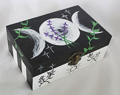 This is a hand painted wooden box featuring lavender and a triple moon.  Most tarot cards will fit in this box, but you can also put other things in it such as crystals or whatever you want. Approximately 6 inches long, 4 inches wide, and 2.5 inches high. I only keep a few things in my etsy shop now.  My full collection of art and antiques has been moved to my website. To see all of my collection you can find it here:  https://www.wildflowermoonmagic.com/ Paint Wood Box Ideas, Hand Painted Tarot Cards, Chest Painting Ideas, Hand Painted Wooden Box Ideas, Whimsy Witch, Witchy Items, Diy Card Box, Witch Balls, Box Painting