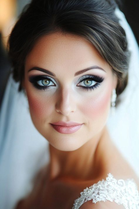 Over 50 glamorous bridal makeup ideas that blend bold colors, dramatic eye accents, and glowing finishes. From classic beauty to high-impact glam, these styles cater to every type of bride. Ready to stand out and feel radiant? Explore all the stunning options here! #bridalmakeuplooks #weddinginspo #makeuptrends Blue Eye Bride Makeup, Blue Bride Makeup, Elegant Wedding Makeup Brides Blue Eyes, Blue Eye Wedding Makeup, Winter Bridal Makeup, Light Blue Makeup, Dramatic Bridal Makeup, Dramatic Winged Eyeliner, Bridal Makeup For Blue Eyes