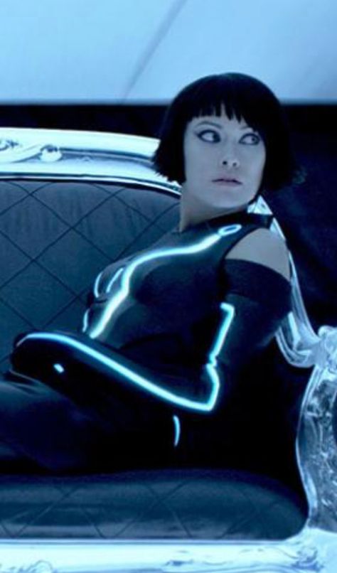 Olivia Wilde's Tron:Legacy costume looks better when she's sitting and turned. She was happy that a sequel was cancelled, saying, "Now I don't have to live on seaweed juice and tofu dust for 6 months to fit into a rubber suit." Olivia Wilde Tron Legacy, Olivia Wilde Tron, Tron Uprising, Nancy Allen, Kingdom Hearts Ii, New Star Trek, Tron Legacy, Light Cycle, Disney Wiki