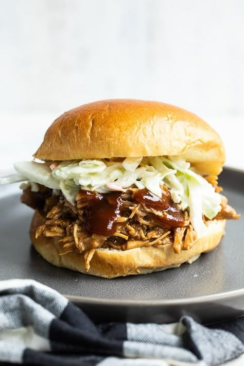 This easy Slow Cooker Pulled Pork is made with my homemade BBQ sauce – it smells incredible while it slow cooks all day and comes out tender and delicious. #slowcooker #crockpot #pulledpork #sandwich #healthy #healthyrecipes #weightwatcherrecipes #lowcalorierecipes #healthyrecipe Easy Pulled Pork Slow Cooker, Sandwich Healthy, Bbq Pulled Pork Sandwiches, Slow Cooker Recipes Pork, Slow Cooker Bbq, Slow Cooker Pulled Pork, Pork Sandwich, Bbq Sauce Homemade, Pulled Pork Sandwich