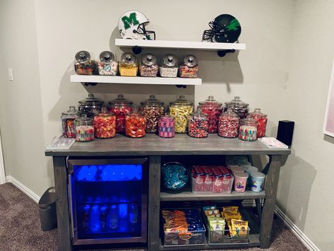 Living Room Snack Bar Ideas, Snack Setup For Room, Movie Theater Rooms Snack Bar, Games Room Snack Bar, Small Basement Hangout Room, Home Theater Candy Display, Game Room Ideas For Couples, Movie Theatre Snack Bar, Bar And Snack Area